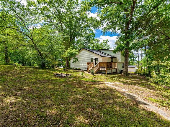 back of home with large back yard