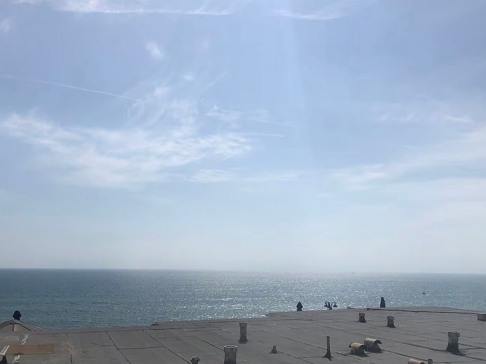 View from living room window over roof. Ocean is right there in front of the property.