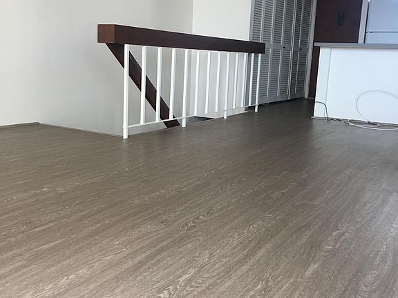 Stairs lead to the bedroom and bathroom