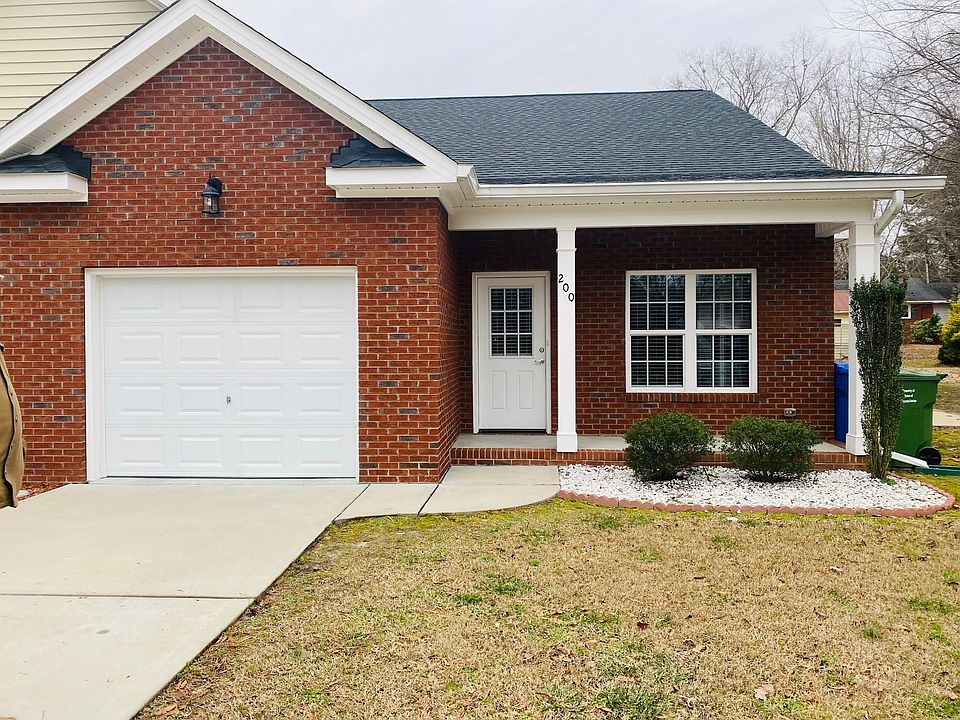 Front, private driveway and garage