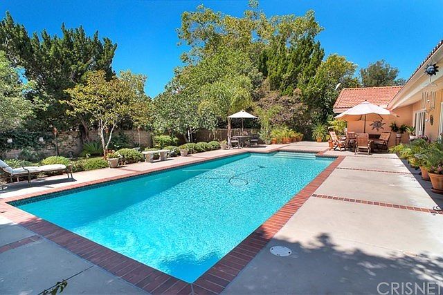 Sparkling Pool, patio and shade trees.