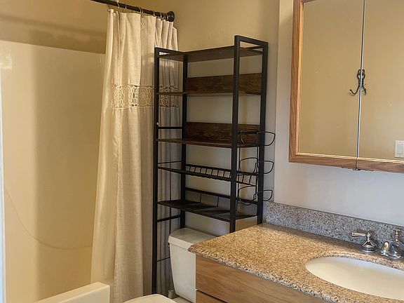 Bathroom with bathtub and shower