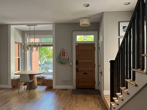 Foyer and dining nook with bay window.