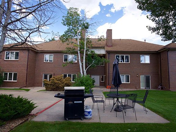 Relax in the tree covered back yard just steps from the 1150 ft condo.