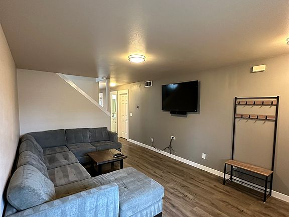 Living room (couch, coffee table, Sony tv & Bose soundbar, and hall tree included)