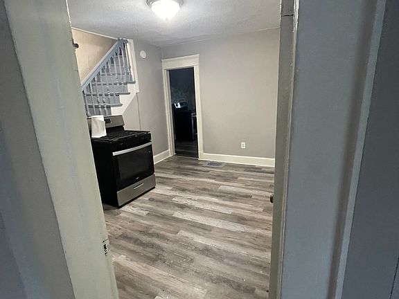 View of living room from front door hallway.
