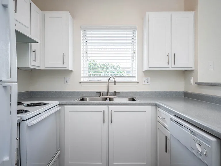 Village at Main Street | 2x2 Kitchen with White Cabinetry and Appliances and Ample Counter Space