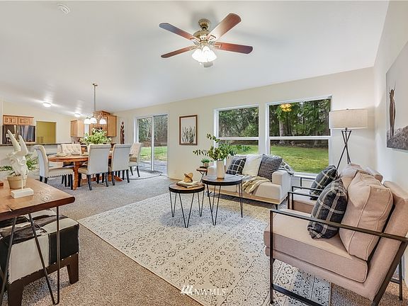 Family room flows seamlessly with dining, kitchen and living room with views of your private backyard