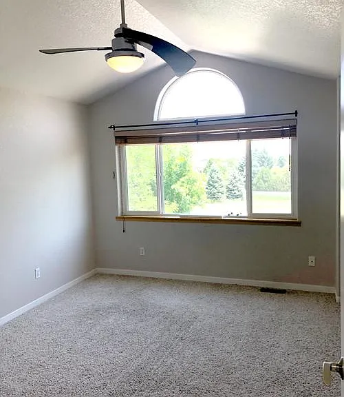 Large primary bedroom overlooking bike trail