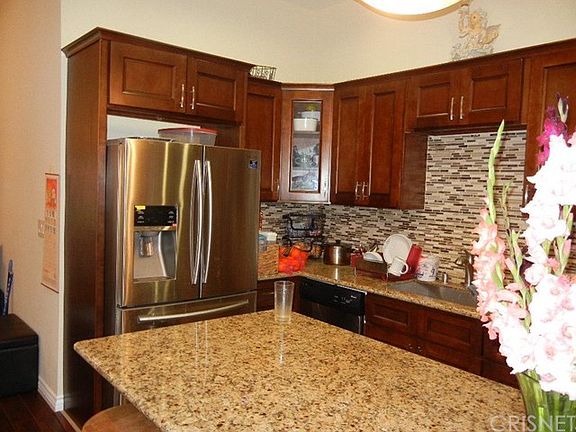 Mini island with granite counter tops. Back-splash