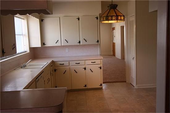  Lovely kitchen with fresh paint, new hardware, ample cabinet space - open and bright floor plan.