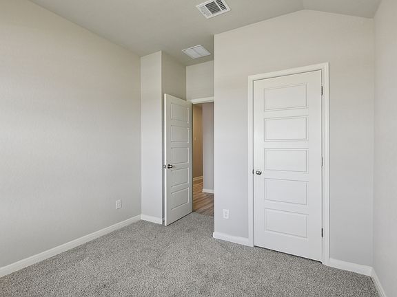 Guest bedroom in the Callaghan floorplan at a Meritage Homes community.
