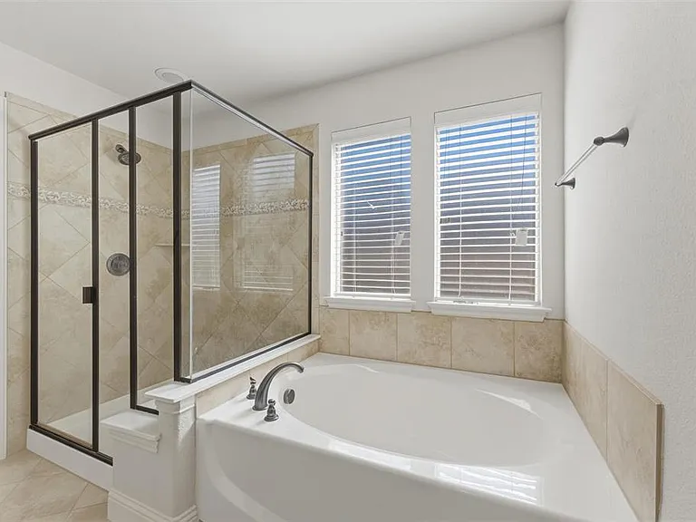 Primary Bathroom with separate shower and garden tub.