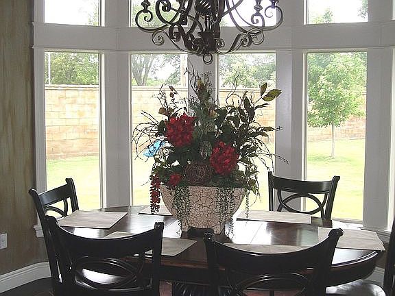 Dining with wrap around windows.