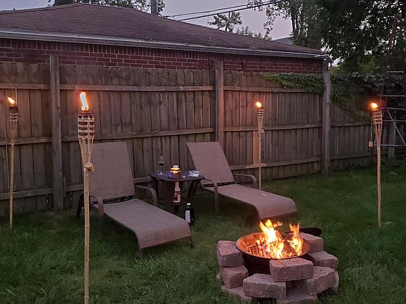 Backyard. Patio furniture included in furnishings.