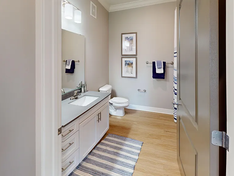 Start and end your day in a bathroom that's as functional as it is stylish _ with a wide vanity, sleek fixtures, and a full shower/tub combo.