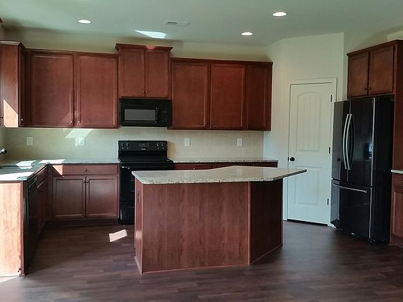 Spacious kitchen with granite and all appliances
