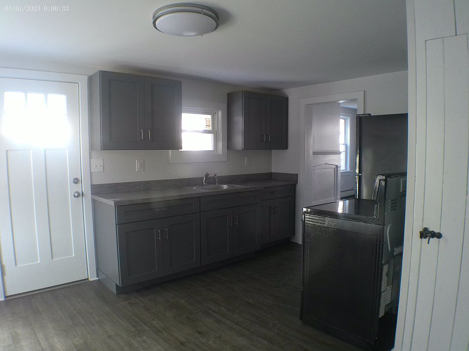 Eat-in kitchen. Side door opens into side porch. Walk-in pantry. Storage access.
