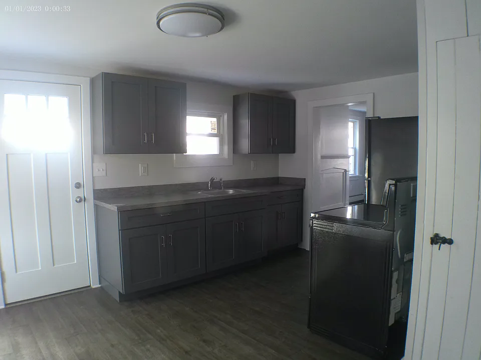Eat-in kitchen. Side door opens into side porch. Walk-in pantry. Storage access.