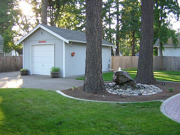 water feature and detached garage