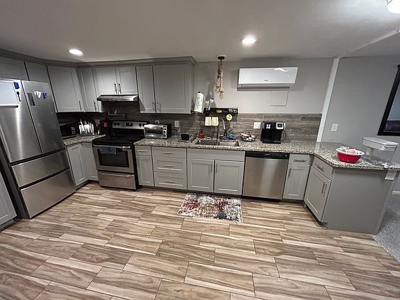 Full kitchen with laundry in unit.