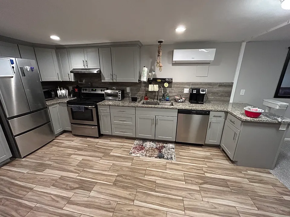 Full kitchen with laundry in unit.