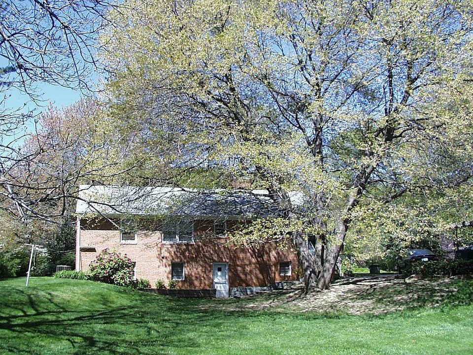 Back of house, huge maple firey red in fall