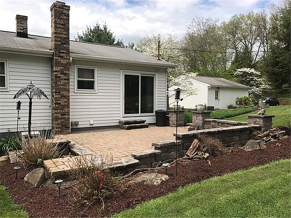 Stone patio located off the kitchen. Great for entertaining or relaxing!