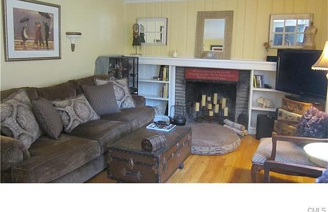 Cozy living room with fireplace, custom built-ins.