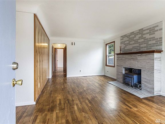 Large living room. Tile fireplace surround is new!