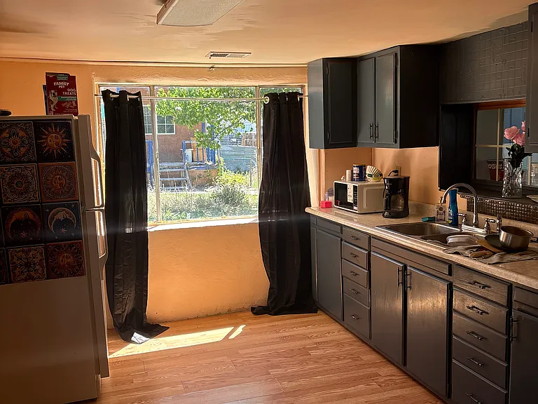 Kitchen with freshly painted cabinets and beautiful natural sunlight