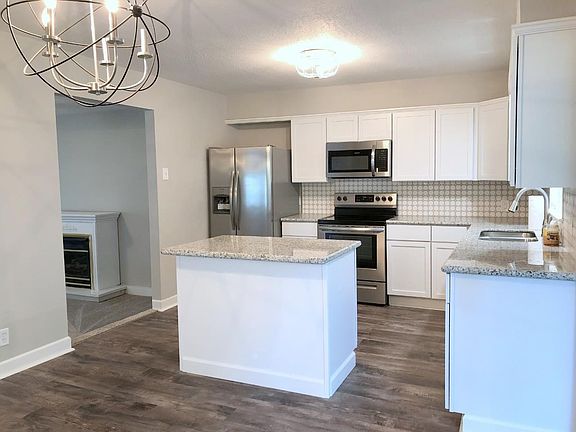 Kitchen with new cabinets, appliances and granite counter tops.