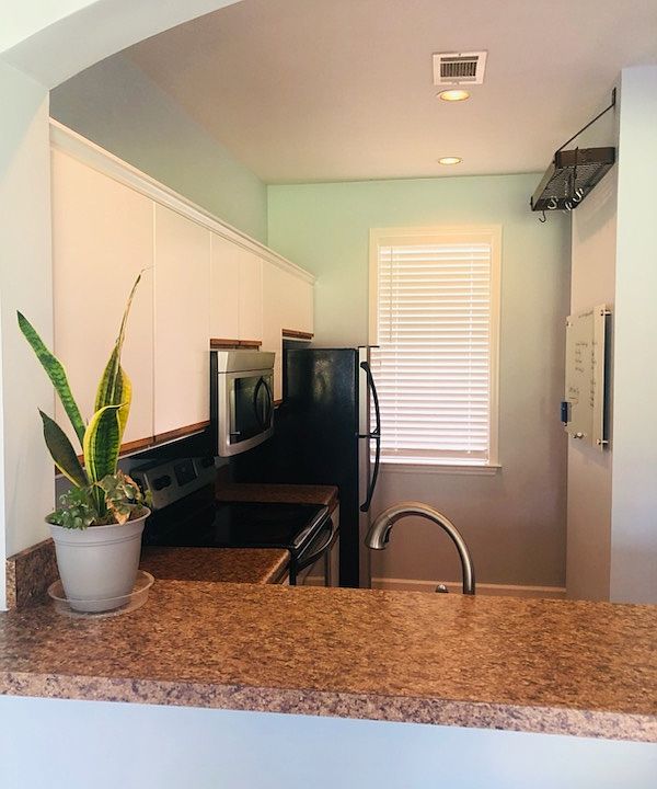 Cozy kitchen with bar to living room area
. Upgraded appliances. Good size pantry and lots of cabinets. Window in kitchen over looks parking area.