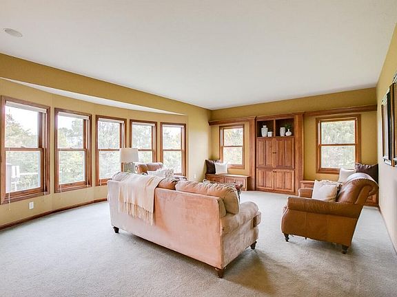 Here is your relaxing family room! Complete with a stunning bay window letting in an abundance of light and beautiful built ins! This is a great space for unwinding!