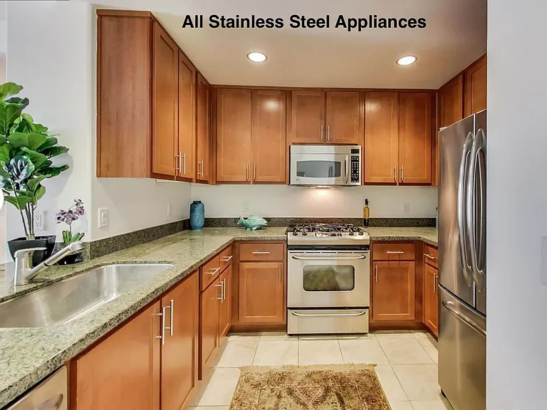 Spacious kitchen with Walk-In Pantry, Granite Counters, and Stainless Steel Appliances.