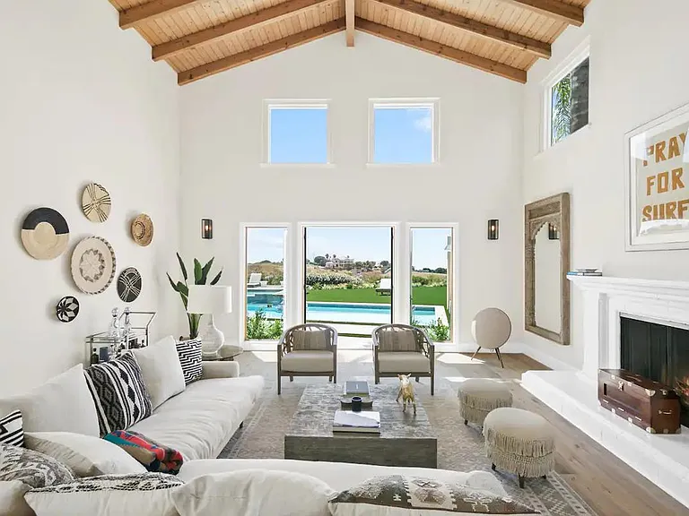 Charming decor align the walls in this bright and airy living space.