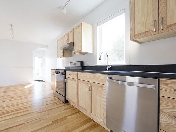 Main level, kitchen (view of main entry, out to private balc