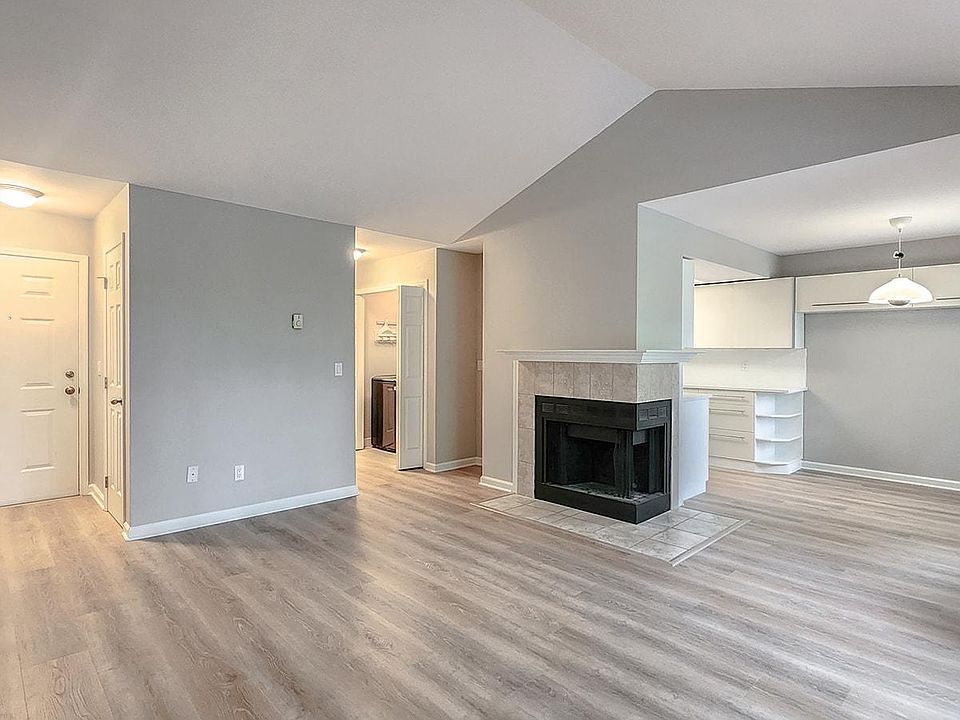 Entry opens to living room with fireplace
