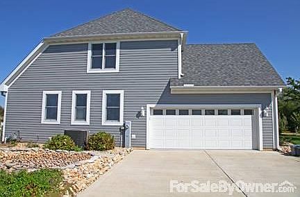 West View of Home
						:
						Maintenance Free Cement Board Siding and Garage Door with Windows.