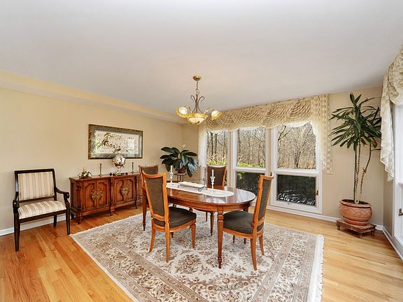 Entertain in grand style, dining room adjacent to the kitchen w/gorgeous views.