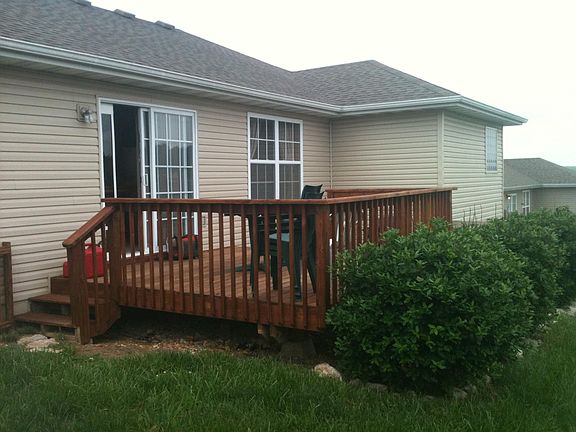 Wooden patio deck and mature plants