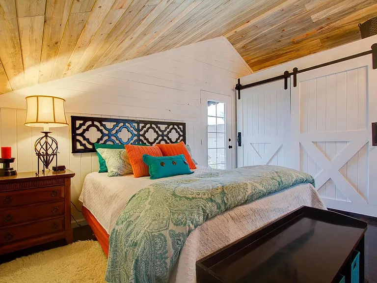 Queen size pillow top mattress, barn door covers closet and washer-dryer