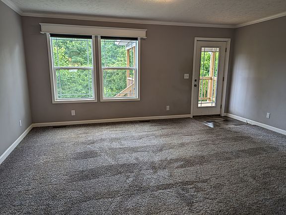 living room and back door with deck and view