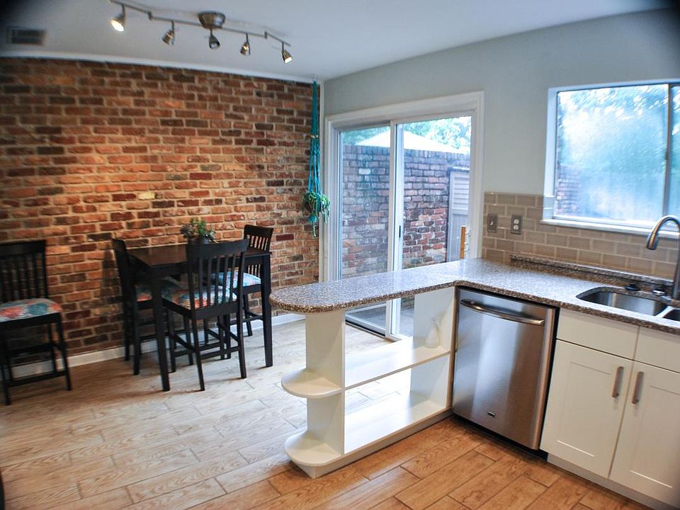 Trendy Brick Wall Next to Kitchen. Great for Entertaining