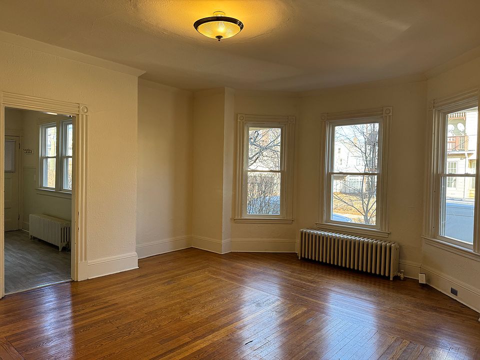 Living room with entrance to kitchen
