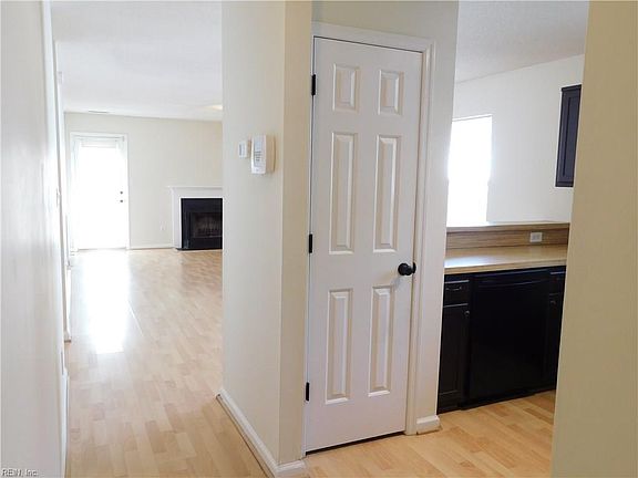 View from just outside of foyer as you approach the living spaces.