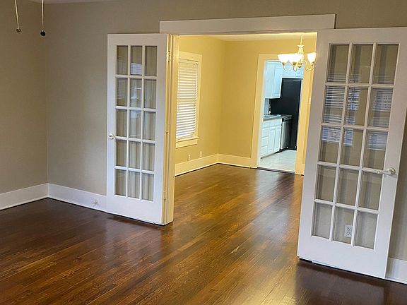 French doors open from Living to Dining. Gorgeous hardwood floors!