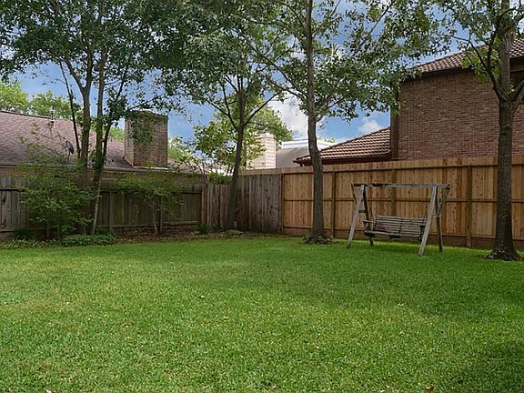 Look at the size of this backyard! It's perfect for a pool or simply having loads of space for the k