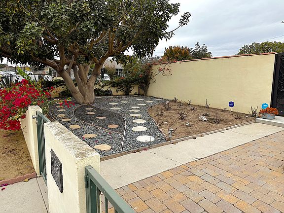 front garden area and walk around. provides a nice relaxing entrance to the home for you or guests.