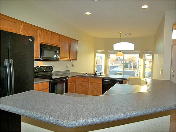 Well lit kitchen includes breakfast bar, pantry, all new appliances, formal dining